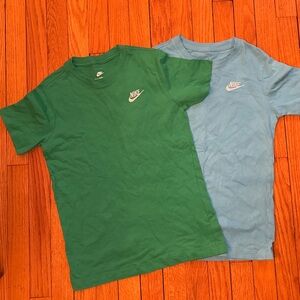 Two Nike Tees. Women’s size M (fitted tee).